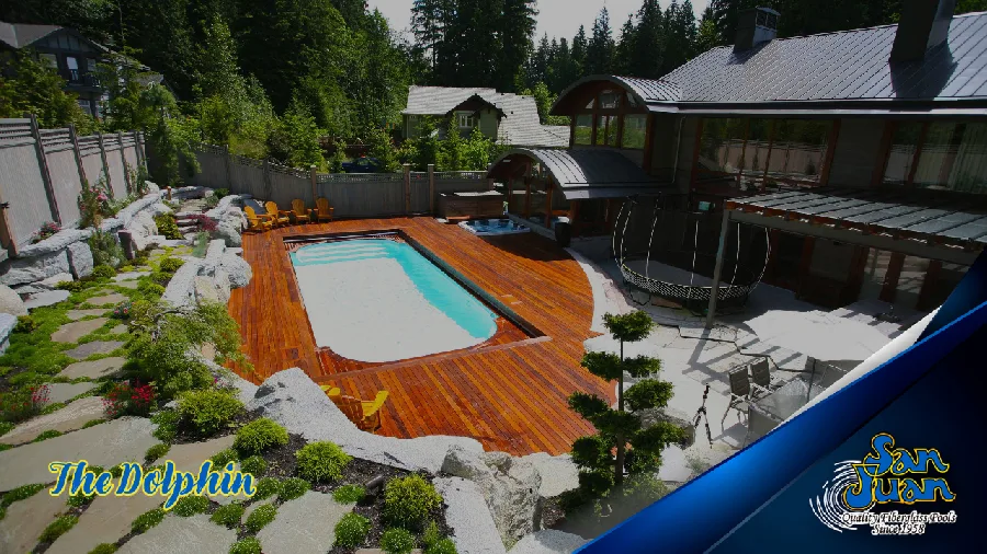 Dolphin fiberglass pool installed in a backyard