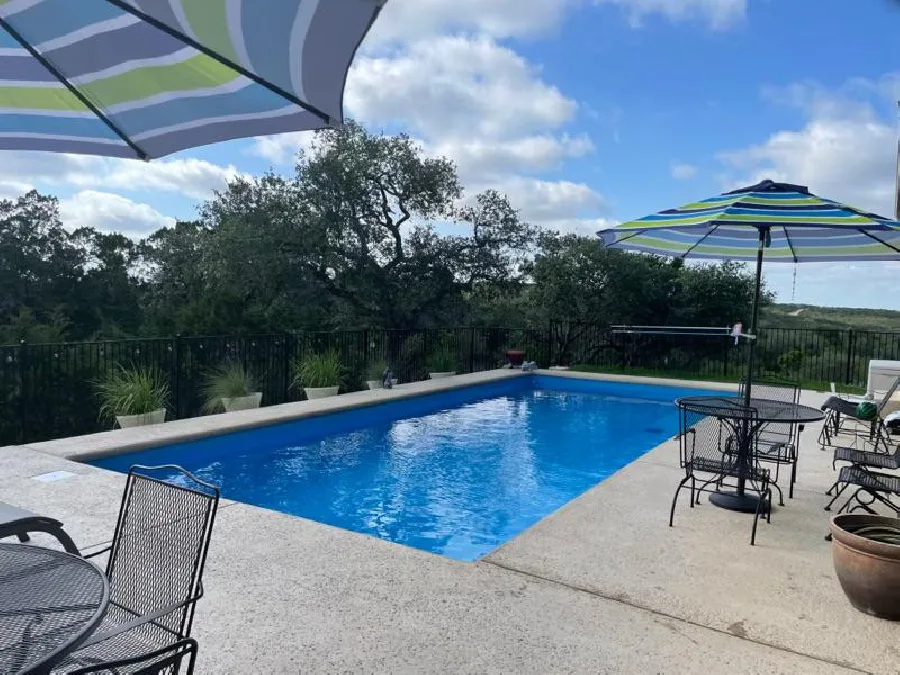 Grand Manhattan East Coast VS2 fiberglass pool installed in a backyard