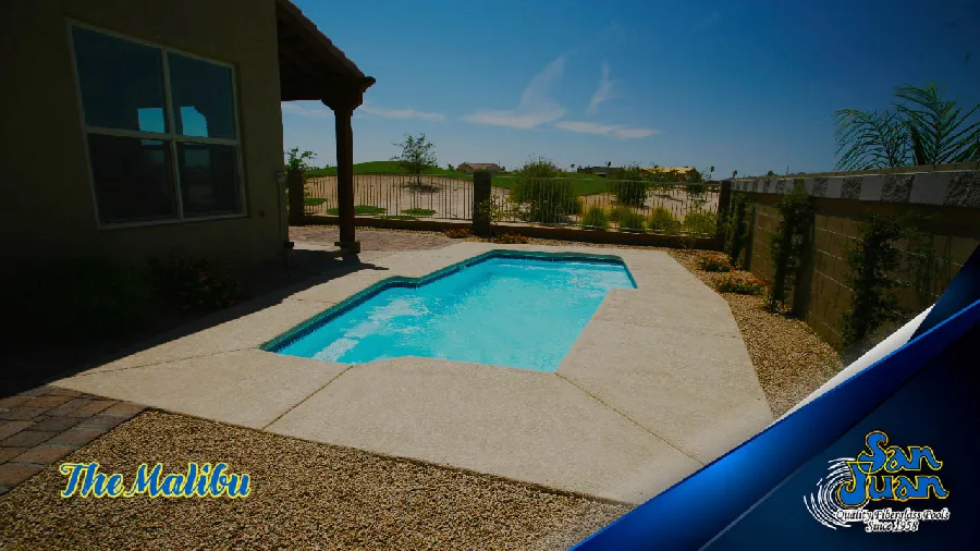 Malibu fiberglass pool installed in a backyard