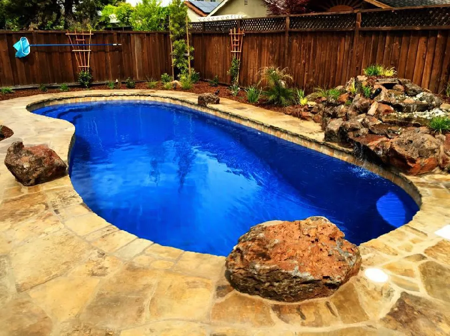 Manatee Deep fiberglass pool installed in a backyard