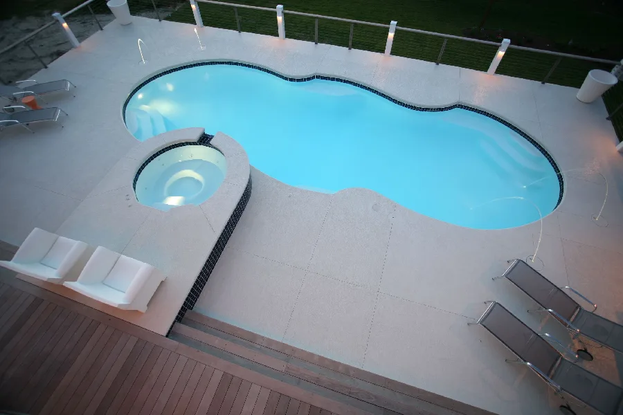 Mirage fiberglass pool installed in a backyard