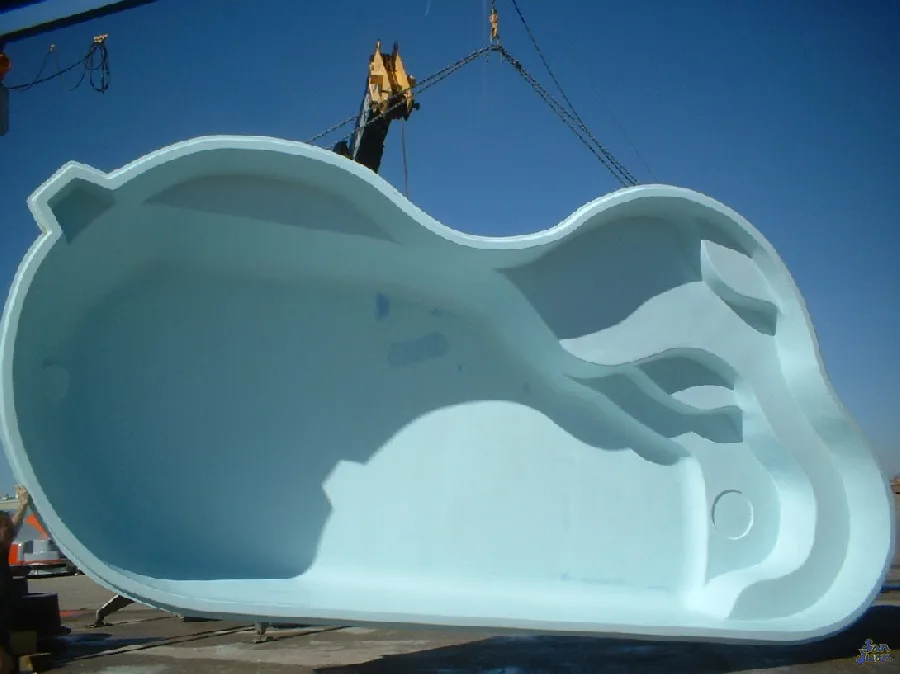 Sandcastle fiberglass pool installed in a backyard