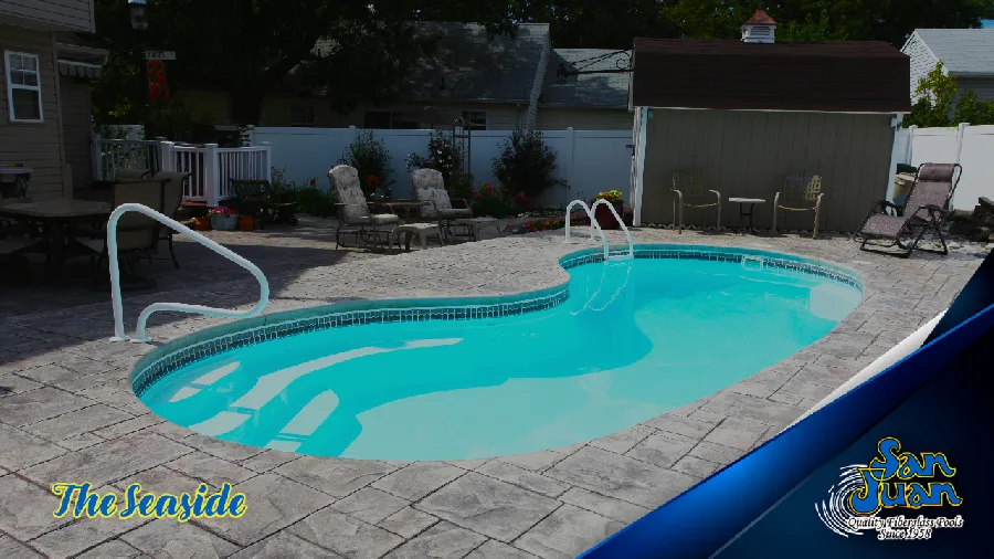 Seaside fiberglass pool installed in a backyard