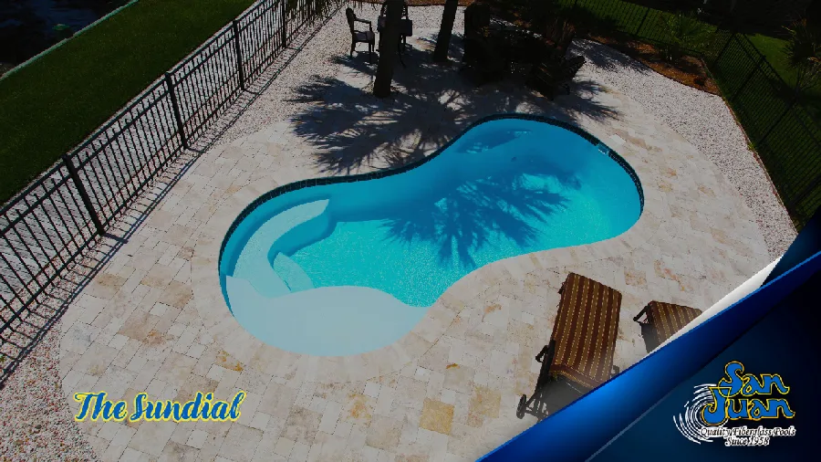 Sundial fiberglass pool installed in a backyard