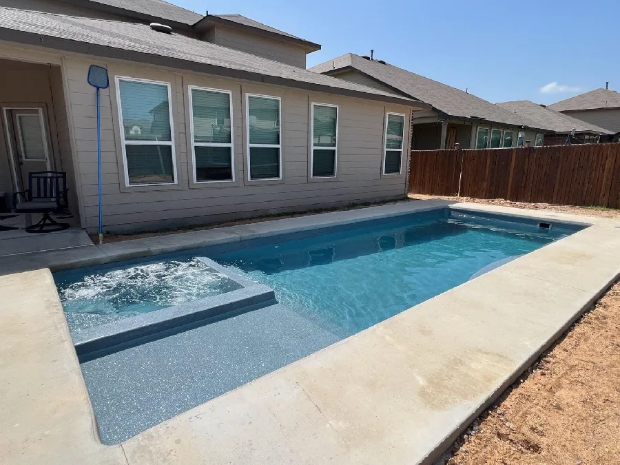 Wylela Cove fiberglass pool installed in a backyard