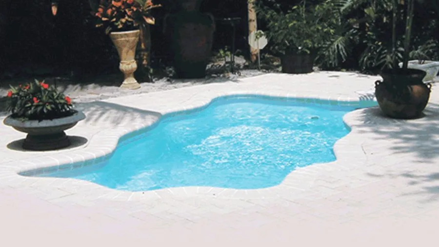 Aruba fiberglass pool installed in a backyard