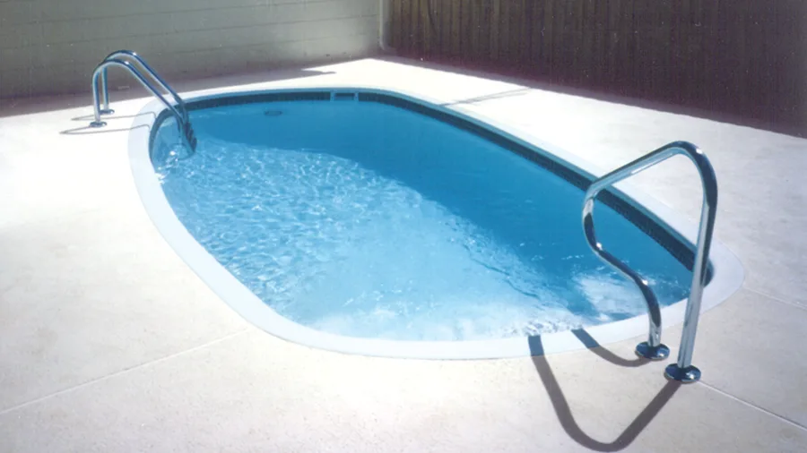 Caladesi fiberglass pool installed in a backyard
