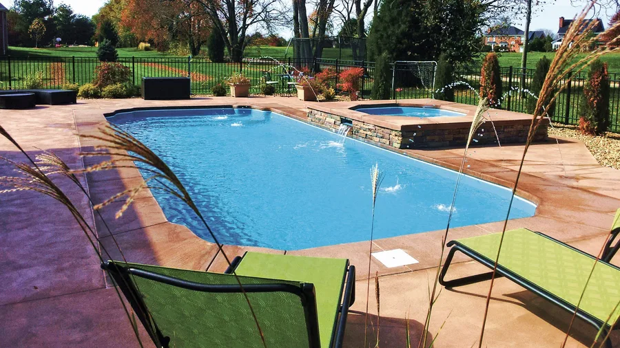 Dominican fiberglass pool installed in a backyard