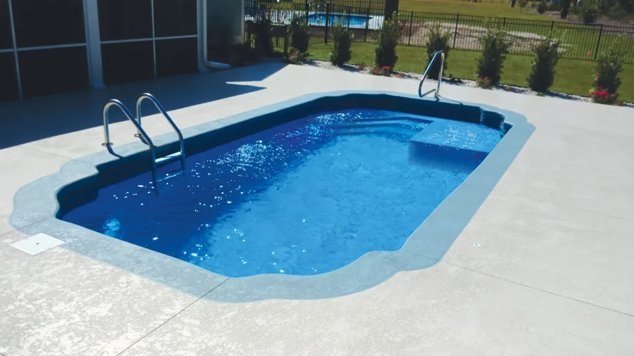 Freeport Oasis fiberglass pool installed in a backyard