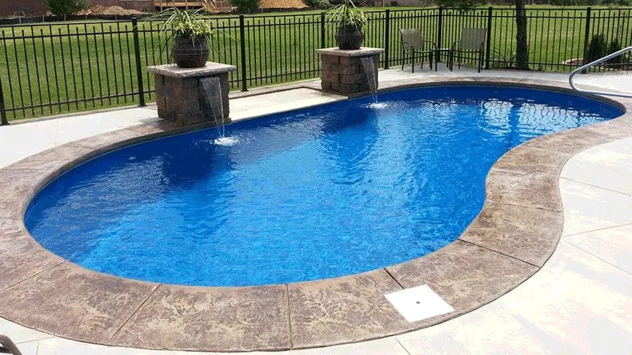 Jamaica fiberglass pool installed in a backyard