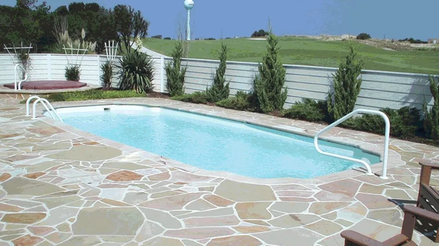 Martinique fiberglass pool installed in a backyard