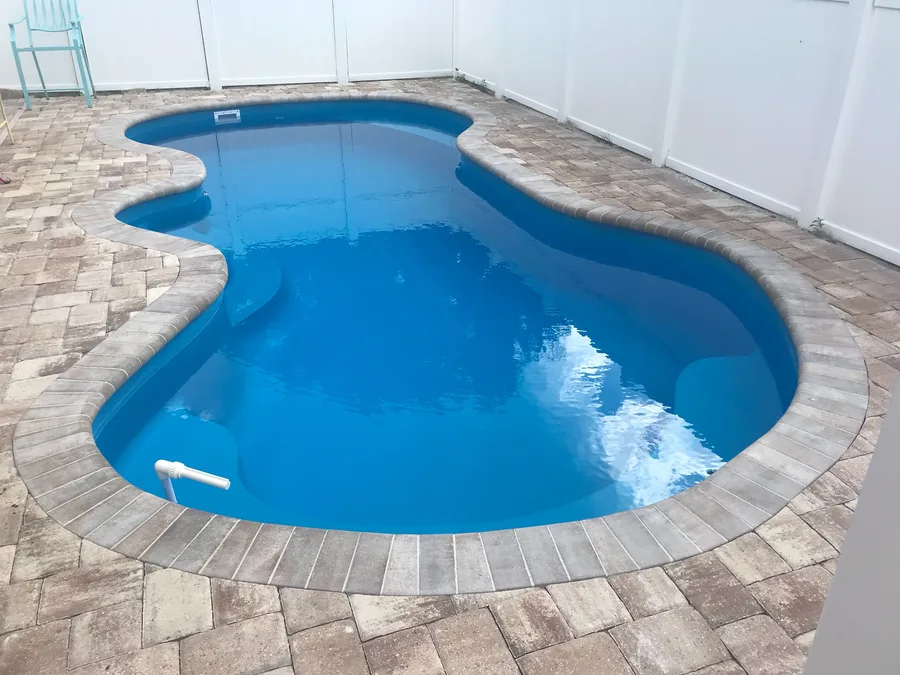 South Beach fiberglass pool installed in a backyard